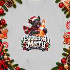 Scottish terrier wearing Santa hat and scarf with traffic cone, "Pawsitively Merry" text.