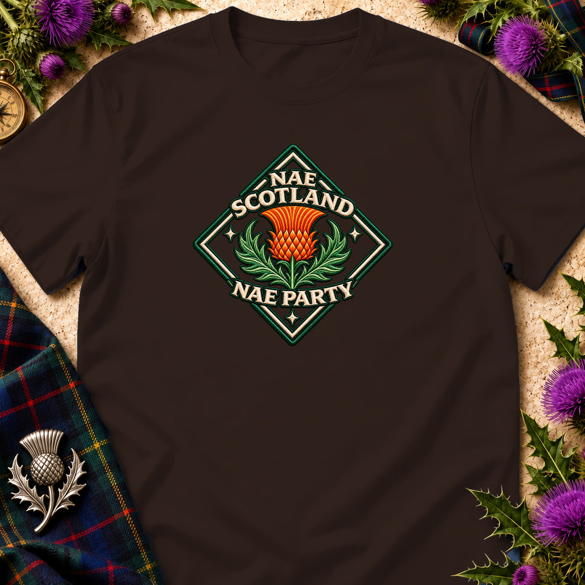 Brown t-shirt featuring a diamond-shaped graphic with an orange thistle, green leaves, and text reading Nae Scotland Nae Party.