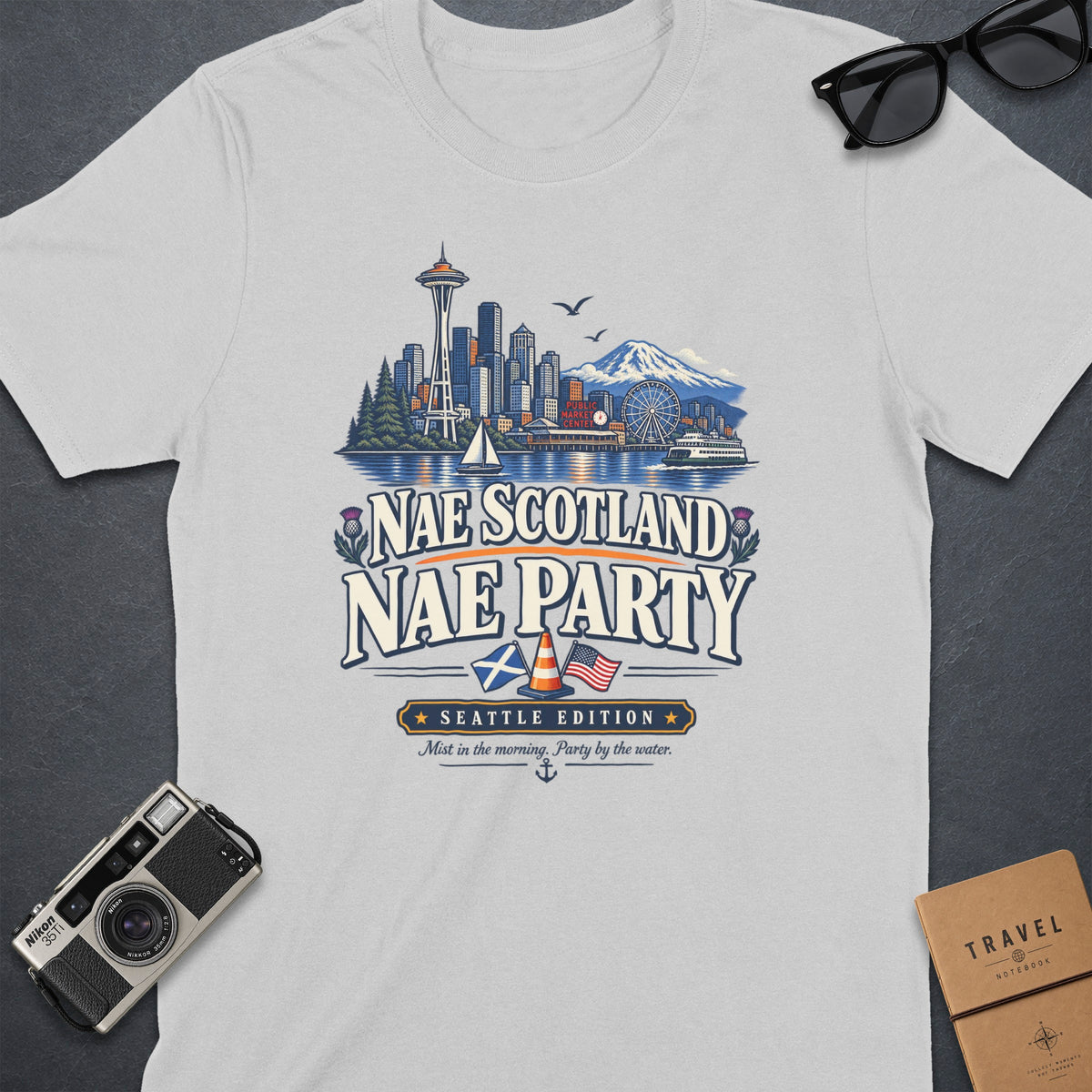 White t-shirt with Seattle skyline, text "NAE SCOTLAND NAE PARTY", Seattle Edition.