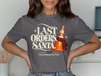Grey t-shirt with "LAST ORDERS, SANTA" text and a traffic cone.