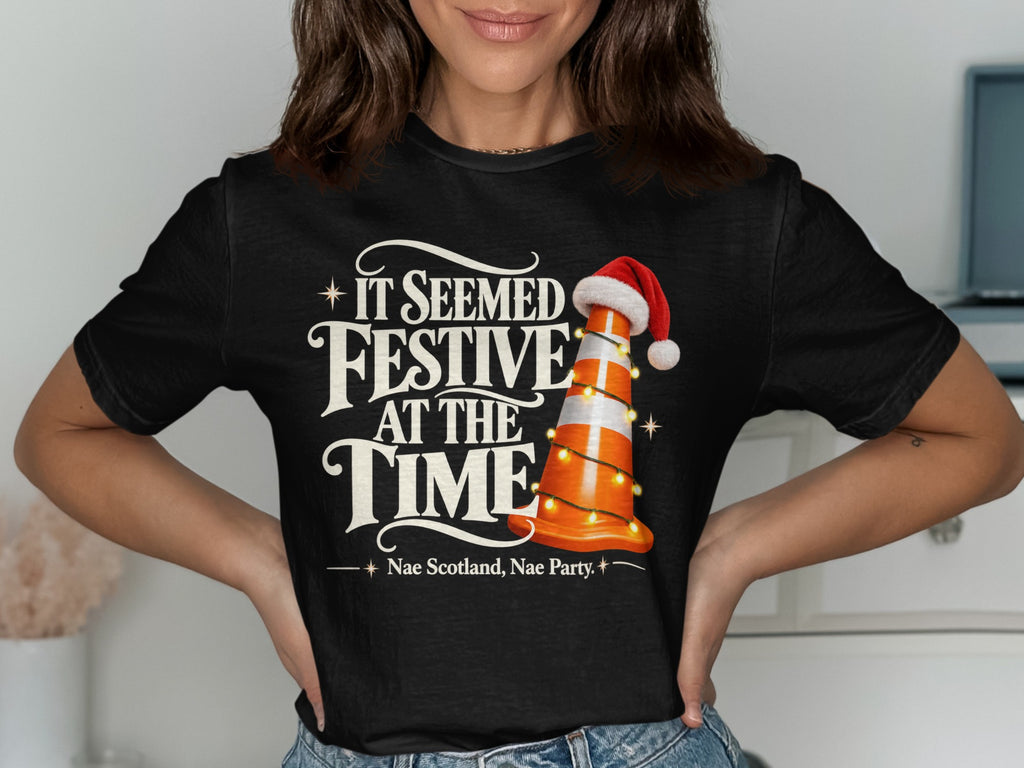 Black t-shirt with "It Seemed Festive At The Time" and traffic cone.