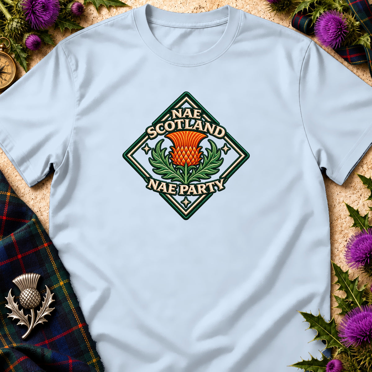 Light blue t-shirt featuring a diamond-shaped crest with a Scottish thistle and the text Nae Scotland Nae Party.