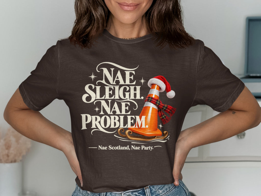 T-shirt graphic: traffic cone in Santa hat on a sleigh with "Nae Sleigh. Nae Problem."