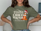 Green t-shirt with text "Festive Choices Were Made" and a Christmas-hatted traffic cone.