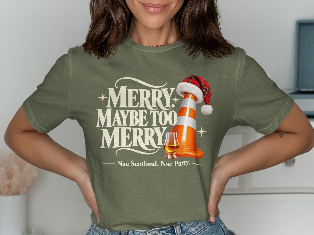 Green t-shirt with "Merry Maybe Too Merry" and Scottish phrase.