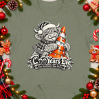Highland cow in Santa hat holding a traffic cone decorated with lights.
