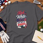 A dark gray t-shirt featuring a golf-themed graphic with the text Red, White, Blue & Way Out of Bounds.