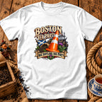 A white t-shirt featuring a colorful graphic with text reading Boston Tea Party and Nae Scotland, Nae Party.