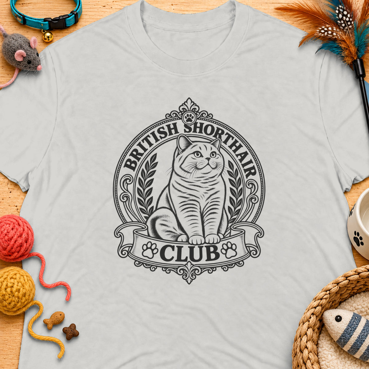 British Shorthair Club logo with a stylized cat on a light grey t-shirt.
