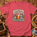 Coral-pink short-sleeve crewneck t-shirt featuring a graphic with a traffic cone, tea crates, and text.