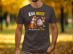 T-shirt graphic with "Egg Heist" and two bunnies with an Easter egg and cone.