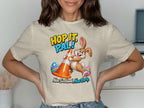 Cartoon bunny with traffic cone, Easter eggs, and text "Hop It, Pal!"