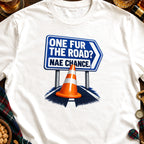 White t-shirt with graphic of blue sign reading "ONE FUR THE ROAD? NAE CHANCE."