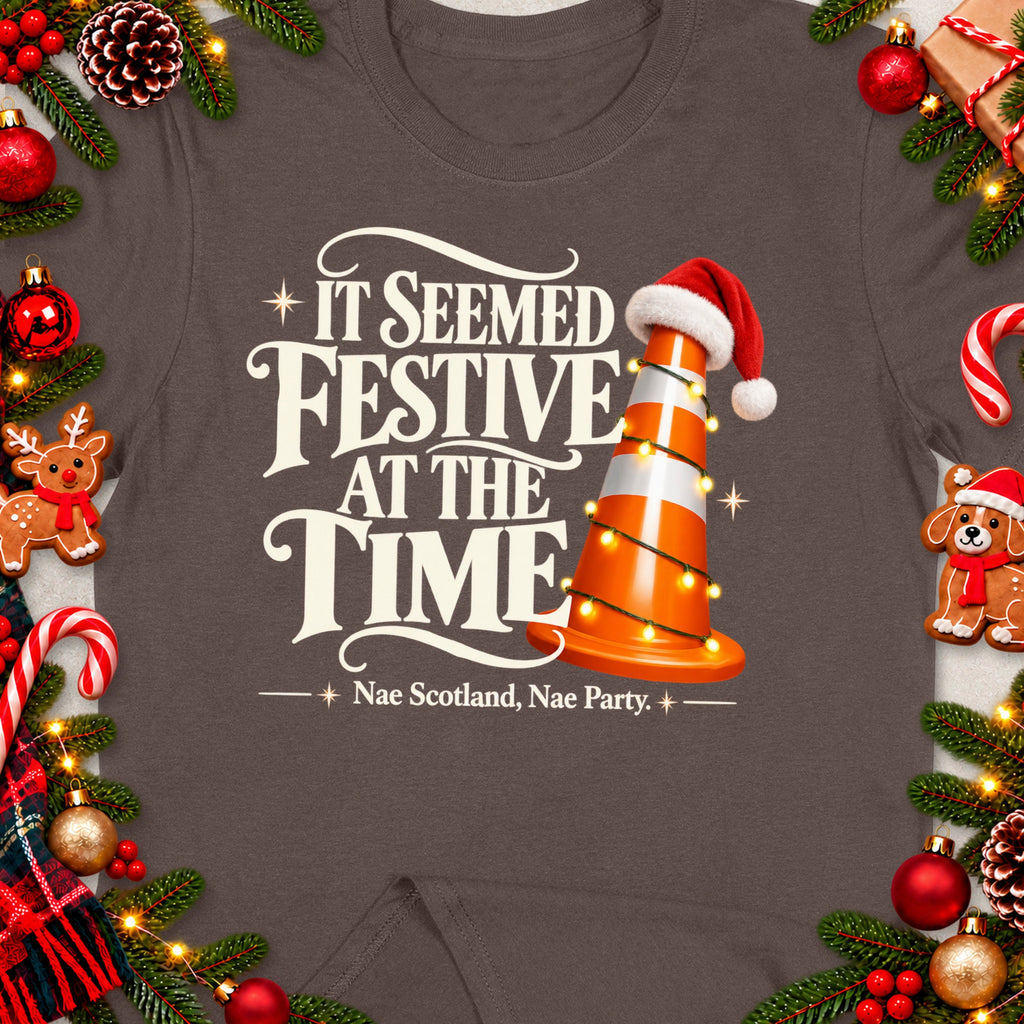 T-shirt with "It Seemed Festive At The Time" and "Nae Scotland, Nae Party" text.