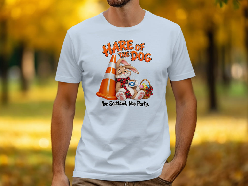 White t-shirt with illustration of a rabbit holding a drink and an Easter basket, with text "Hare of the Dog".