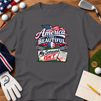 Charcoal grey t-shirt featuring a golf-themed patriotic graphic with the text America the Beautiful My Scorecard Isn't.
