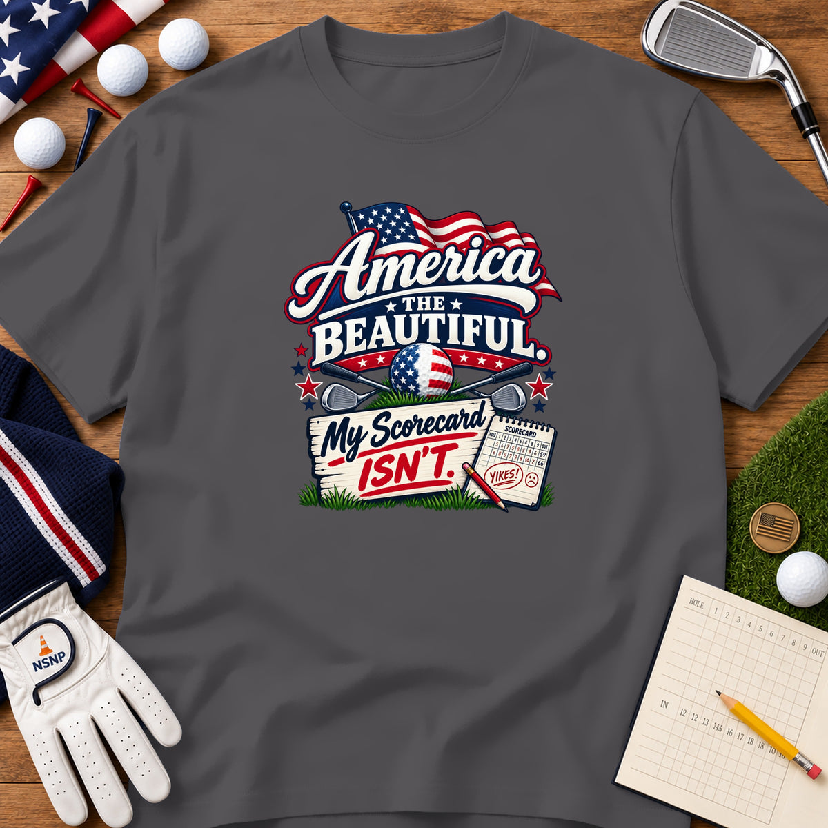 Charcoal grey t-shirt featuring a golf-themed patriotic graphic with the text America the Beautiful My Scorecard Isn't.
