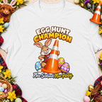 T-shirt design with rabbit holding a traffic cone and text "Egg Hunt Champion".