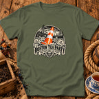 An olive green t-shirt featuring a graphic print of a traffic cone amidst a stormy sea with sailing ships and tea crates, with text reading "Boston Tea Party, Nae Scotland, Nae Party".