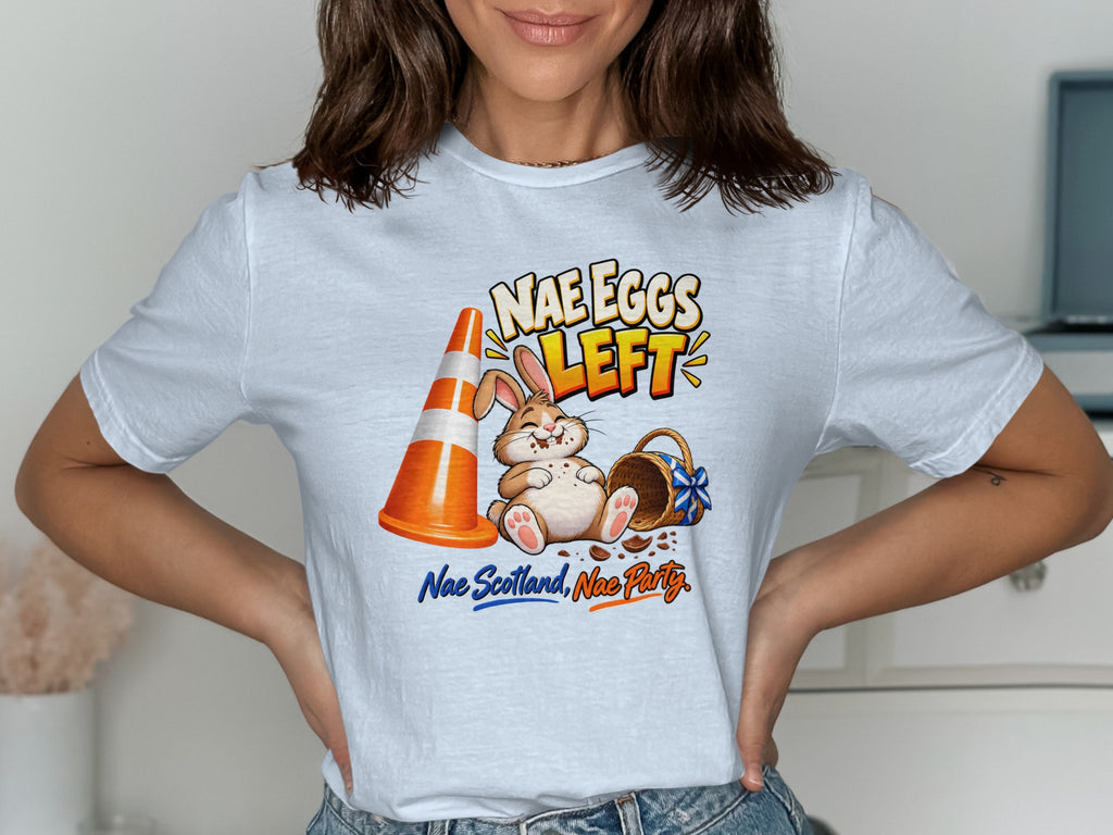 Easter bunny sits next to traffic cone and empty basket with text "Nae Eggs Left."