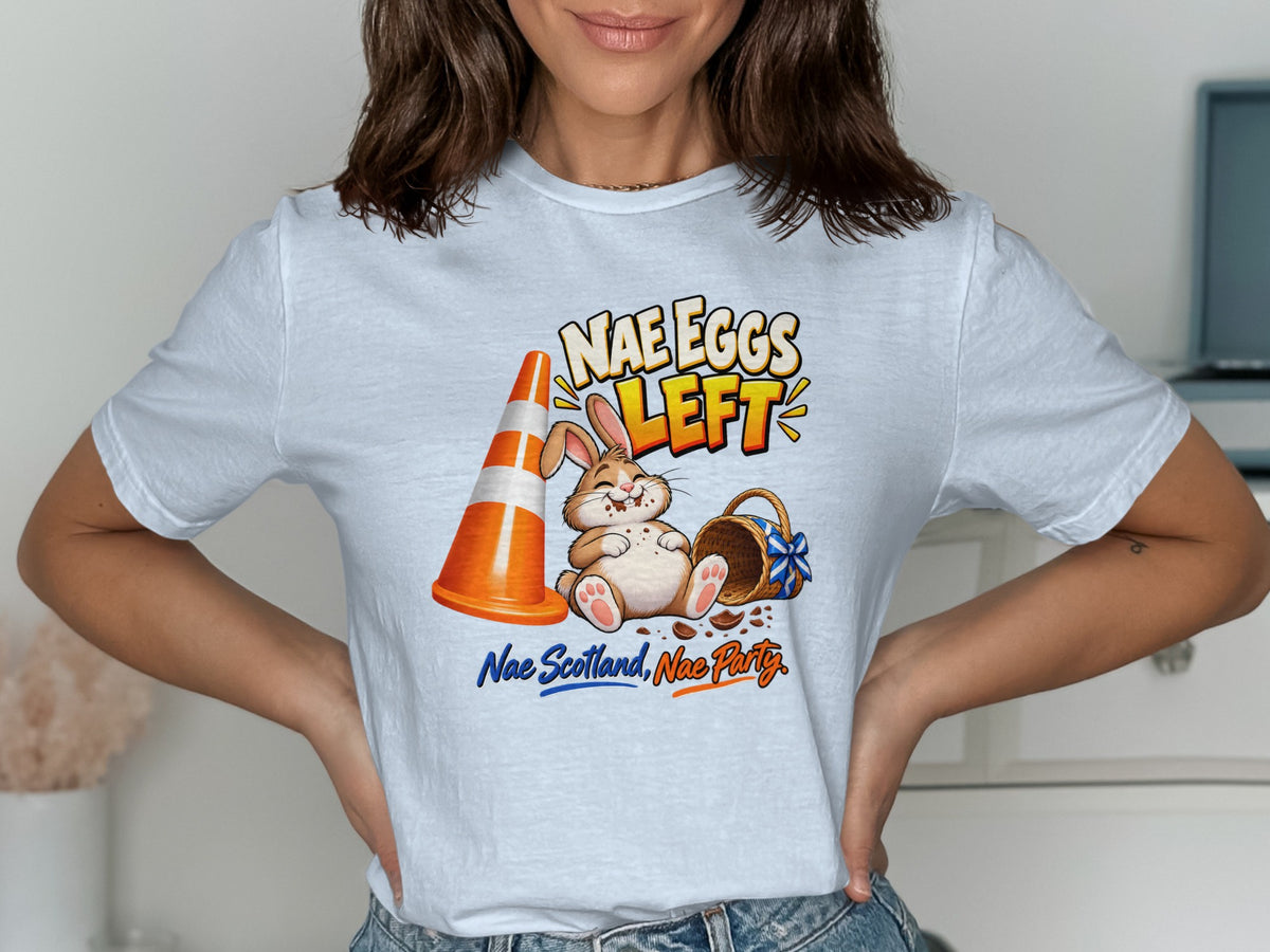Easter bunny sits next to traffic cone and empty basket with text "Nae Eggs Left."