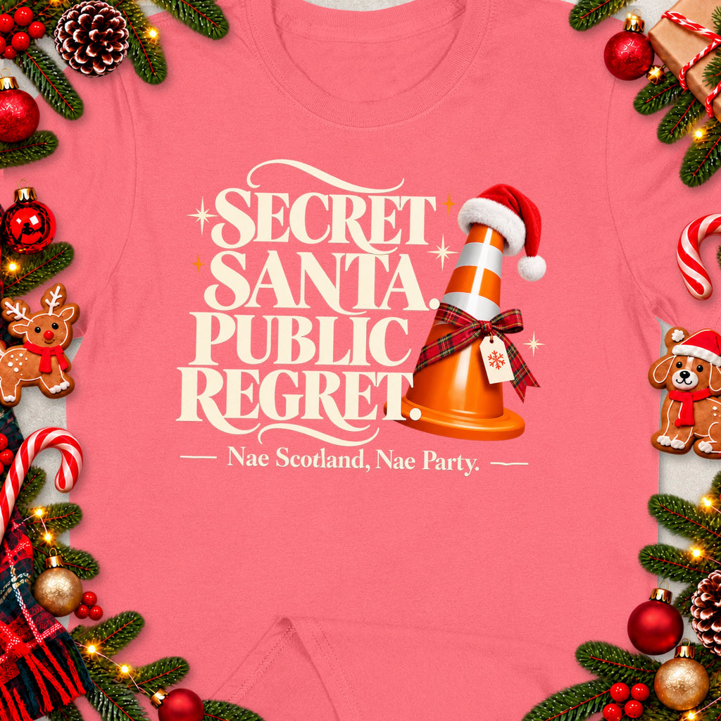 Pink t-shirt with "Secret Santa Public Regret" and a traffic cone.