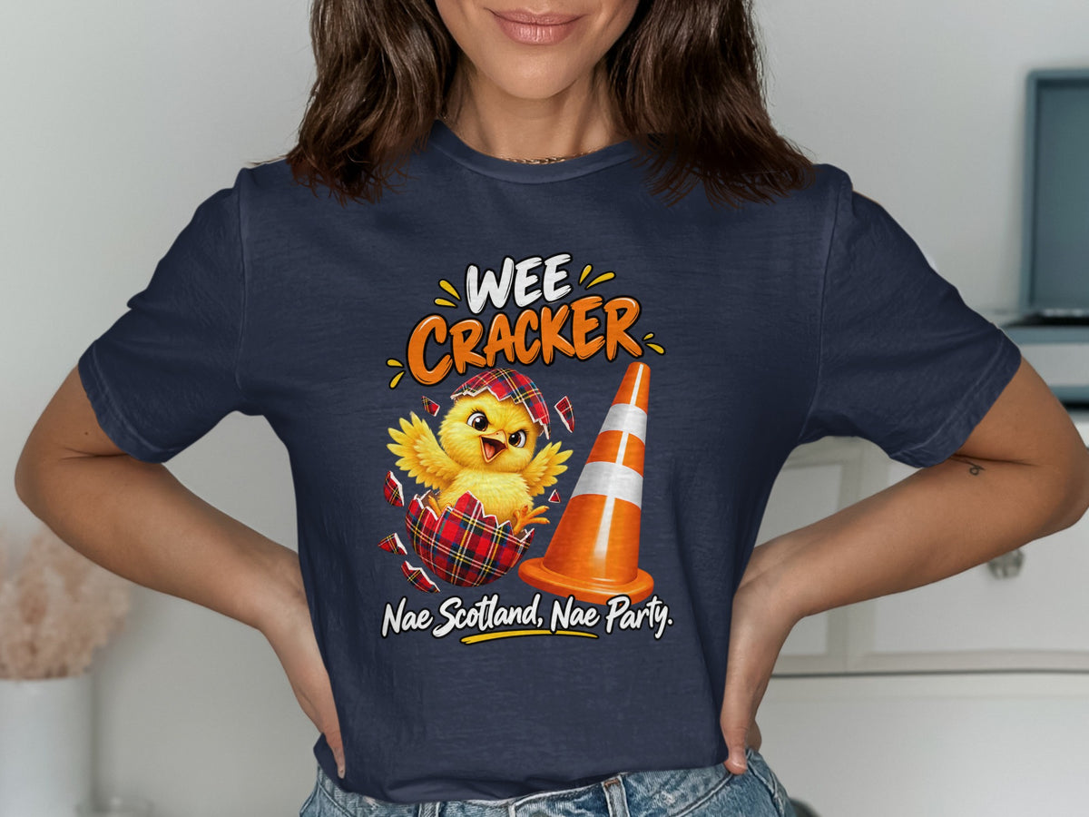 Chick hatching from plaid eggshell next to traffic cone, "Wee Cracker Nae Scotland, Nae Party."