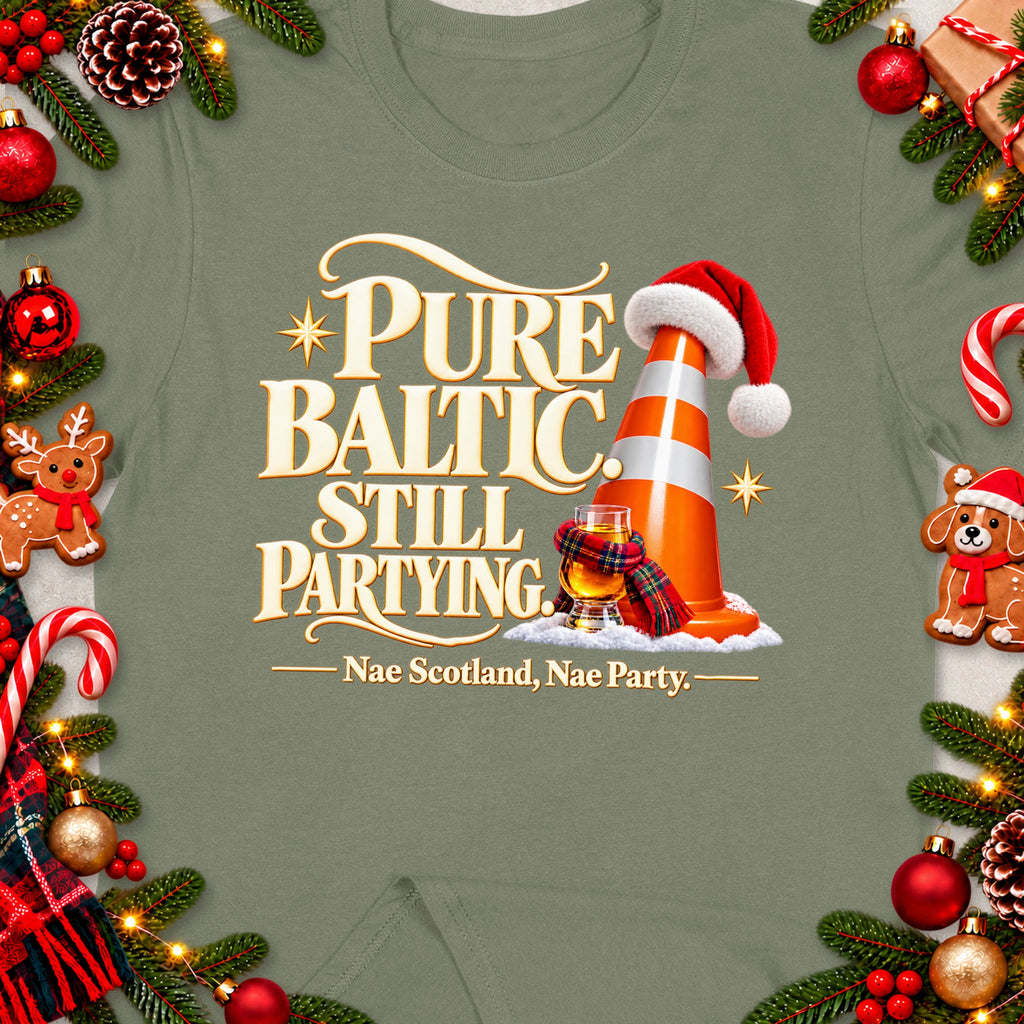 T-shirt with "Pure Baltic Still Partying. Nae Scotland, Nae Party." text, festive decorations.