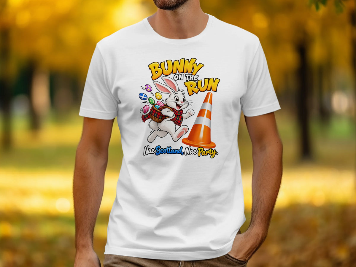White t-shirt with a cartoon bunny, Easter eggs, and text "Bunny on the Run".