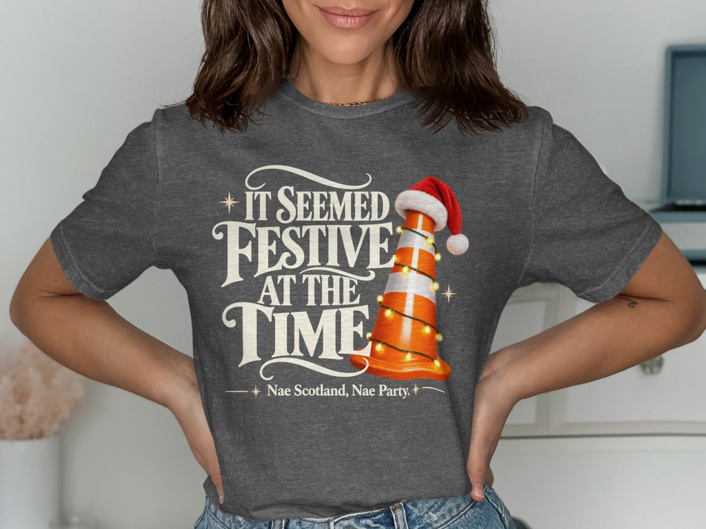 Grey t-shirt with text "It Seemed Festive At The Time" and a traffic cone.