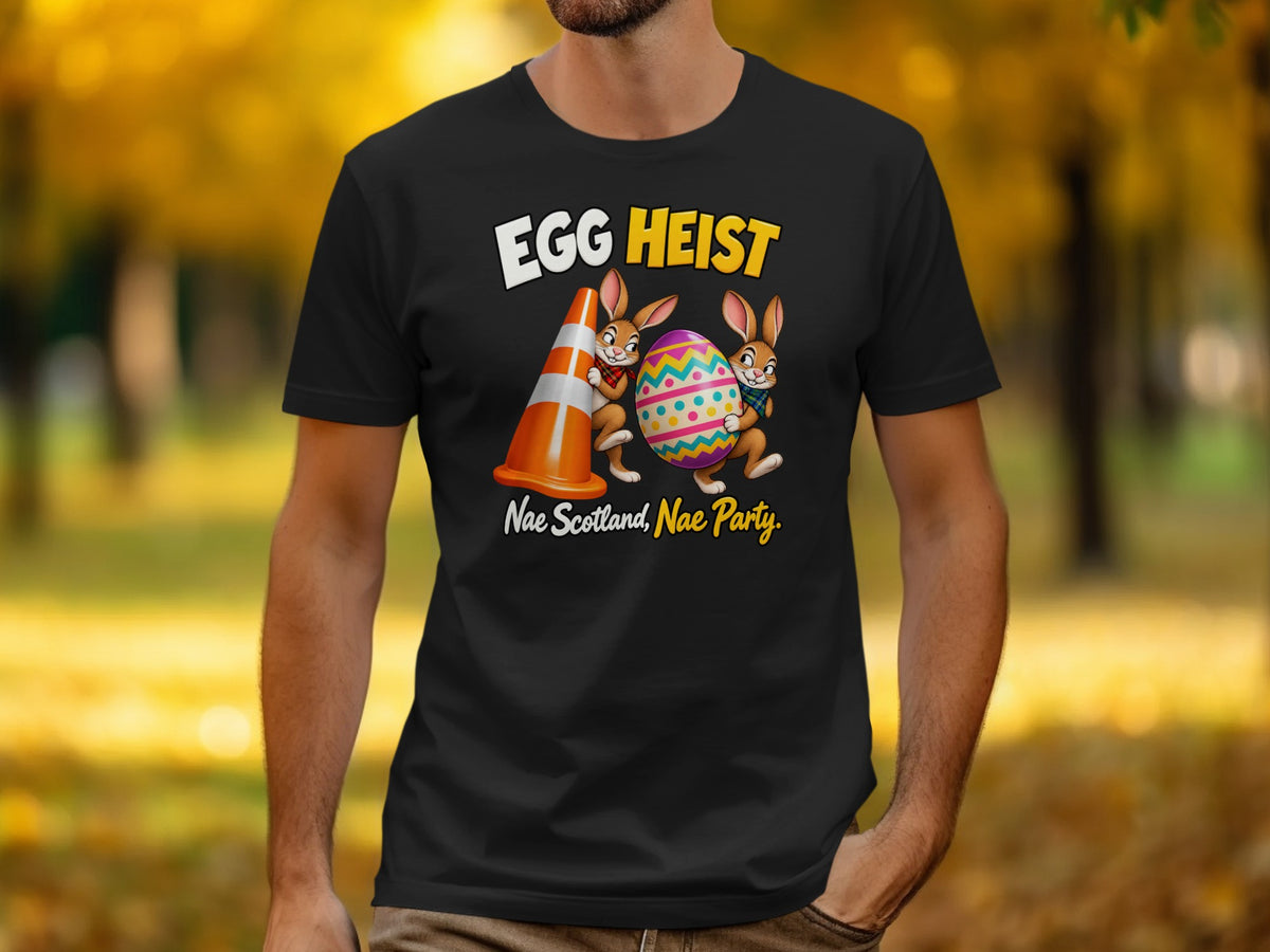 Black t-shirt with "EGG HEIST" and two bunnies holding an Easter egg.