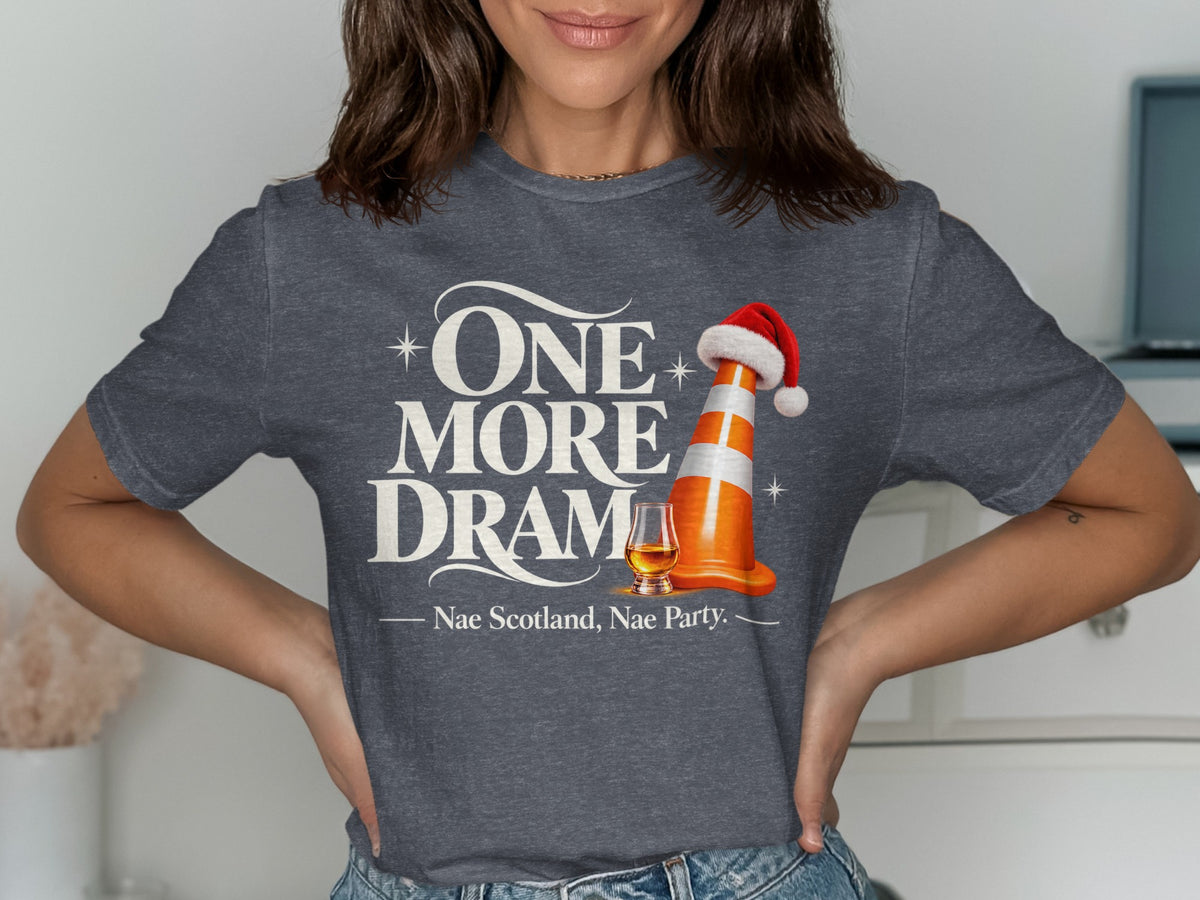 Dark gray t-shirt with "ONE MORE DRAMA" text, a traffic cone with Santa hat, and "Nae Scotland, Nae Party."