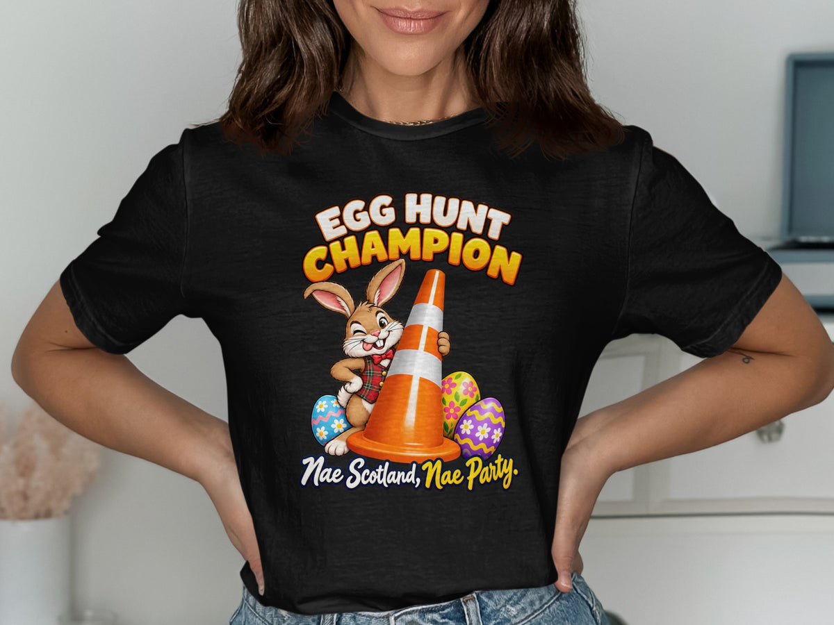 Black t-shirt with a cartoon bunny holding a traffic cone and text "EGG HUNT CHAMPION".