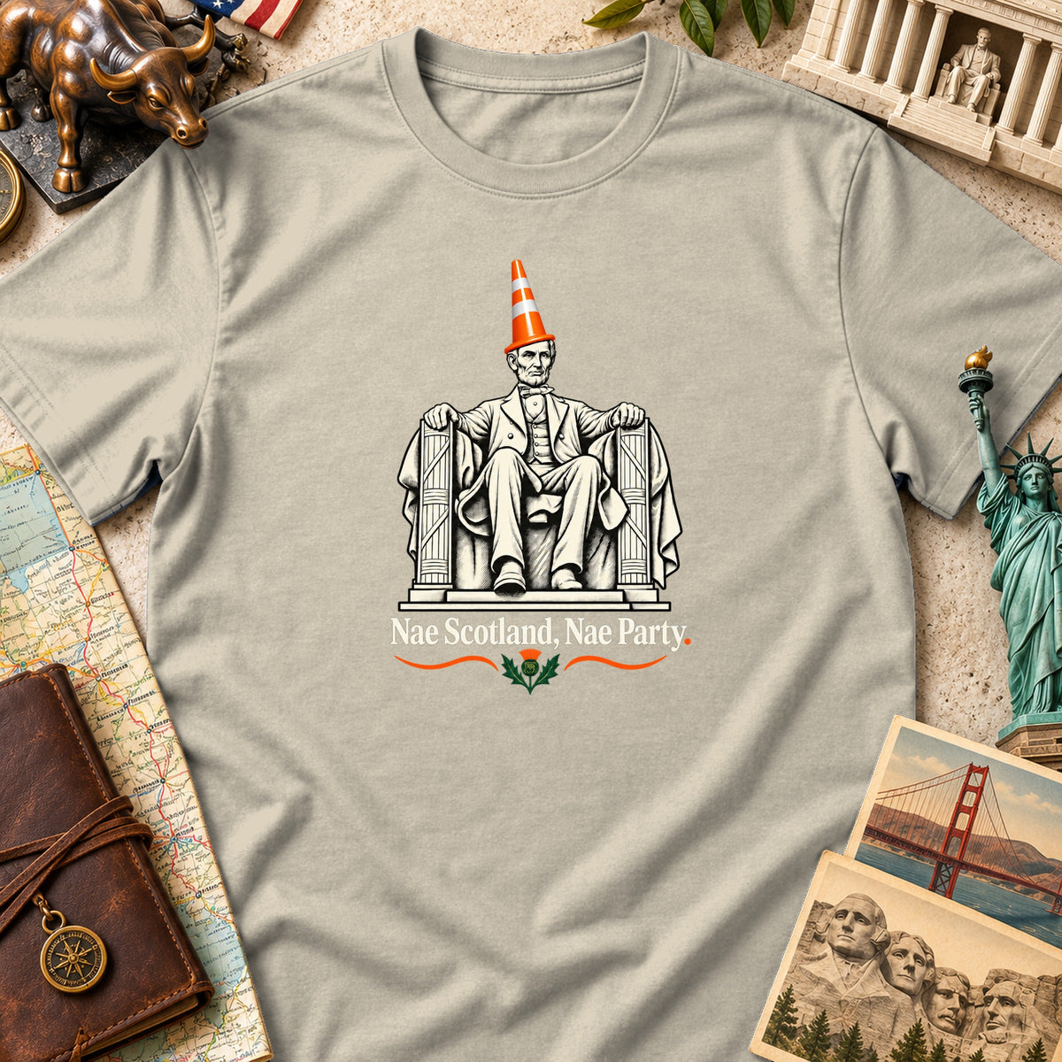 A light gray t-shirt featuring a graphic of Abraham Lincoln wearing a traffic cone and text reading Nae Scotland, Nae Party.