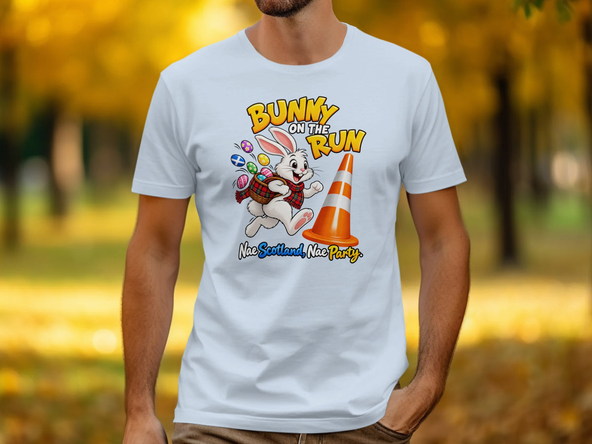 White t-shirt with "Bunny on the Run" graphic featuring a rabbit with Easter eggs and a traffic cone.