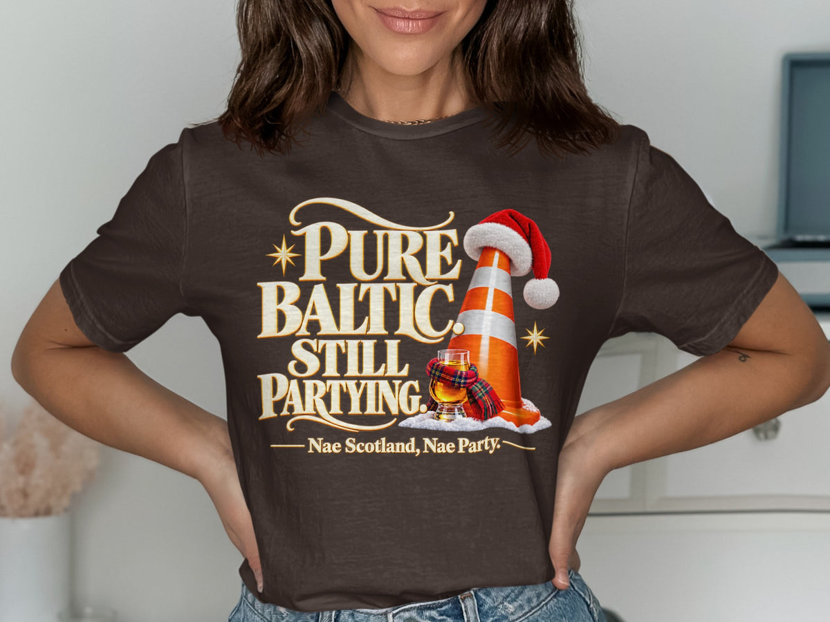 Brown t-shirt with text "Pure Baltic Still Partying. Nae Scotland, Nae Party."