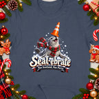 T-shirt design features a seal wearing a scarf and traffic cone, with "Seal-ebrate" text.