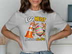 Easter bunnies with an egg and traffic cone, "Egg Heist" text above.