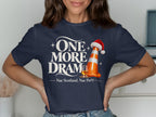 T-shirt with "One More Dram" and a traffic cone wearing a Santa hat.