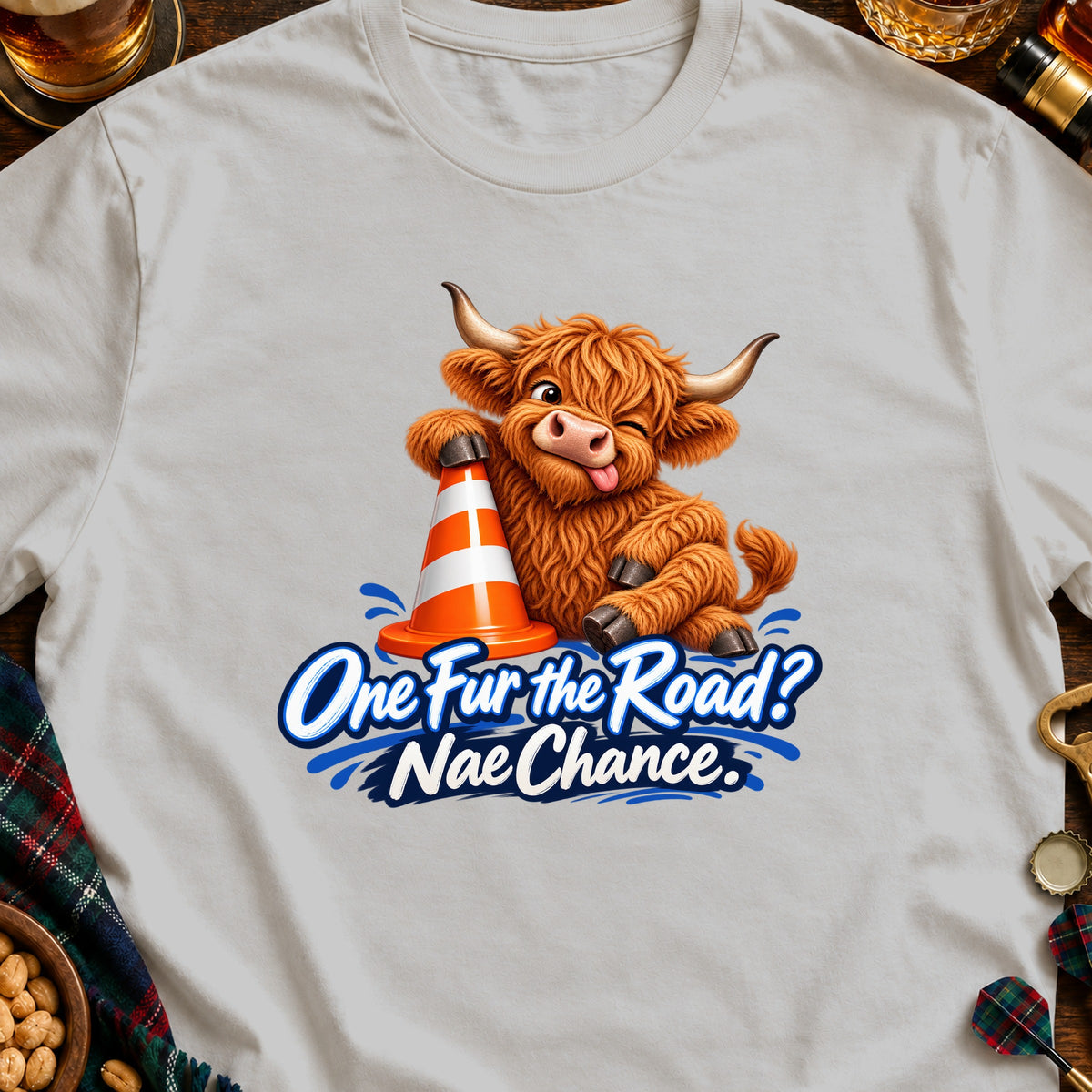 Highland cow graphic with orange cone and text "One Fur the Road? Nae Chance."
