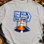 T-shirt graphic with text "ONE FUR THE ROAD? NAE CHANCE." and a traffic cone.