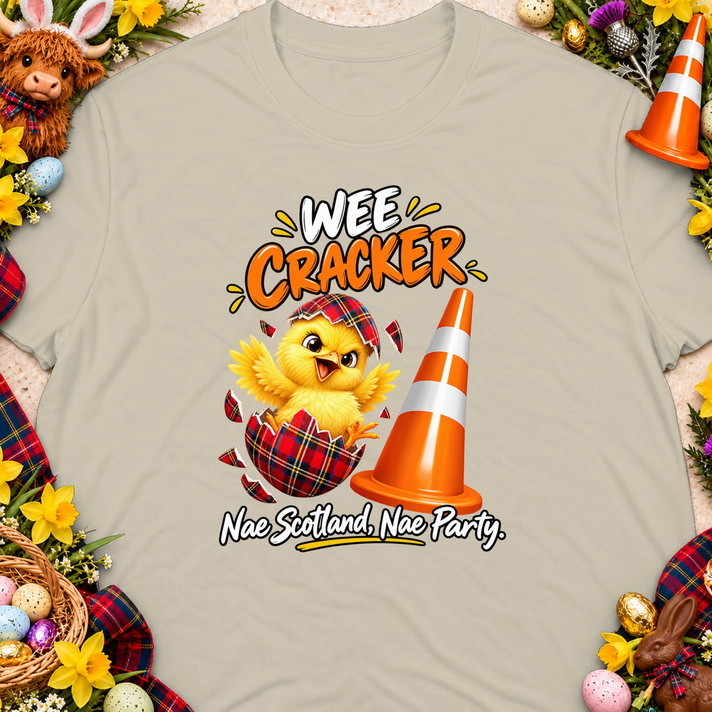 T-shirt with chick hatching from a tartan egg, traffic cone, and text "WEE CRACKER Nae Scotland, Nae Party."