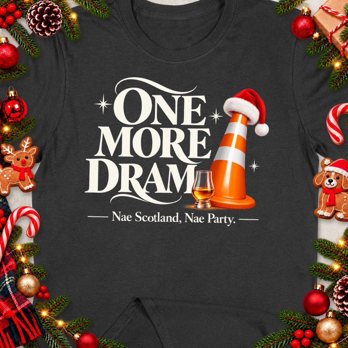Dark t-shirt with "ONE MORE DRAM" text, traffic cone, whisky glass, and festive decorations.