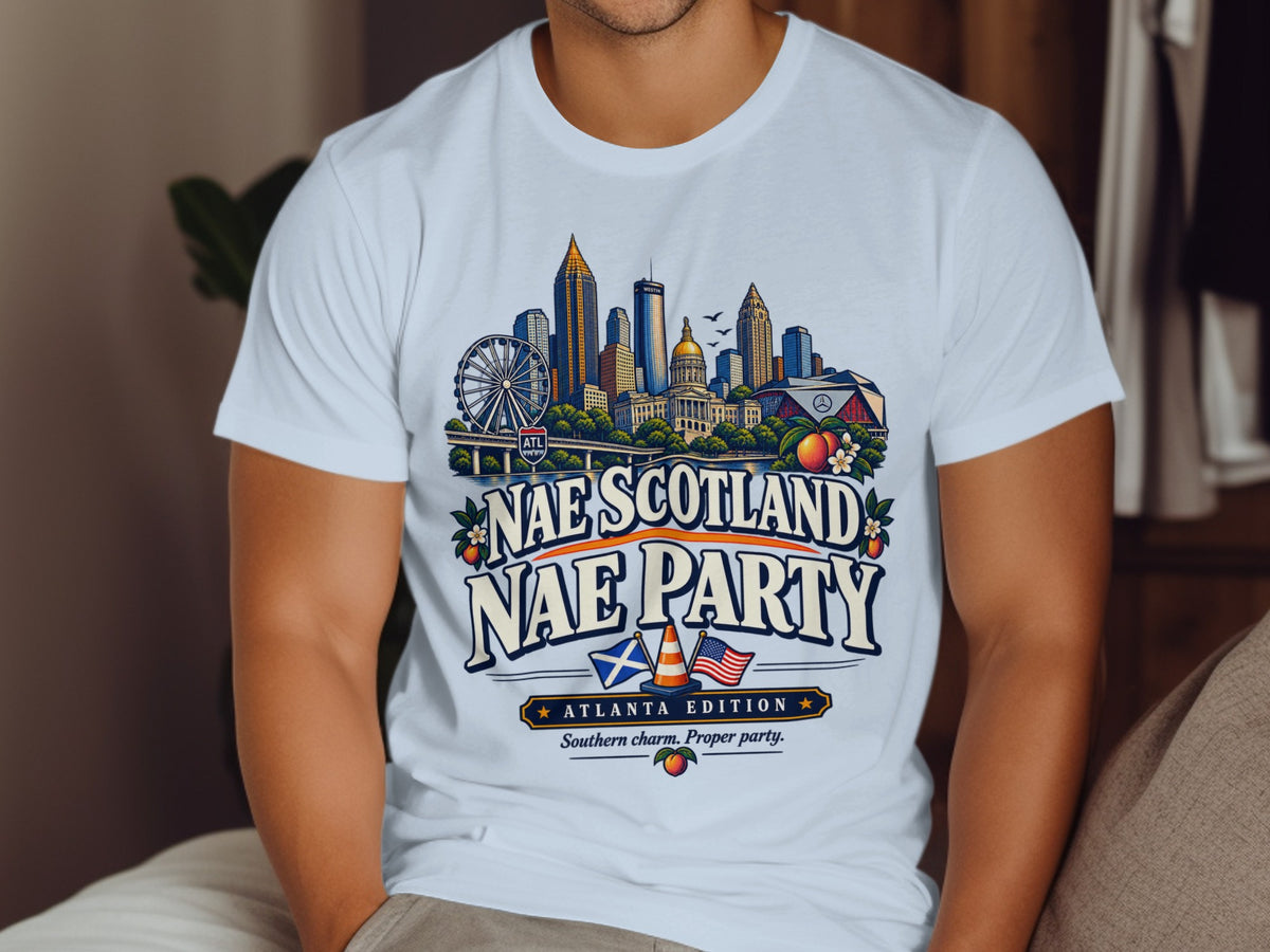 White t-shirt with Atlanta skyline, "Nae Scotland Nae Party" text, and Southern charm tagline.