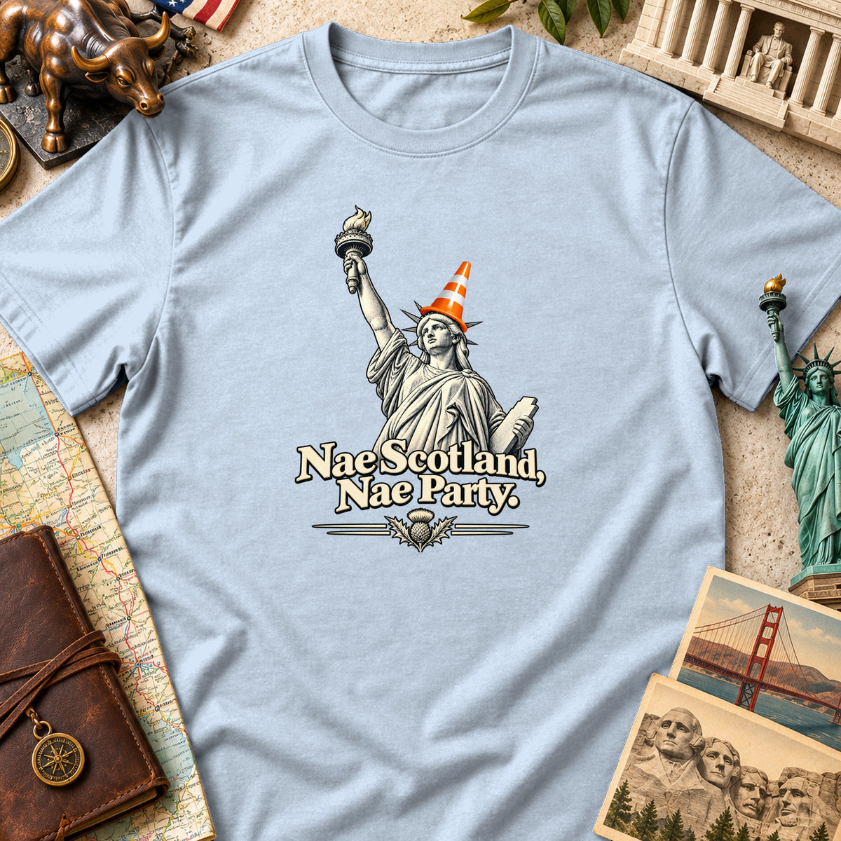 Light blue t-shirt featuring the Statue of Liberty wearing a traffic cone and the text "Nae Scotland, Nae Party."