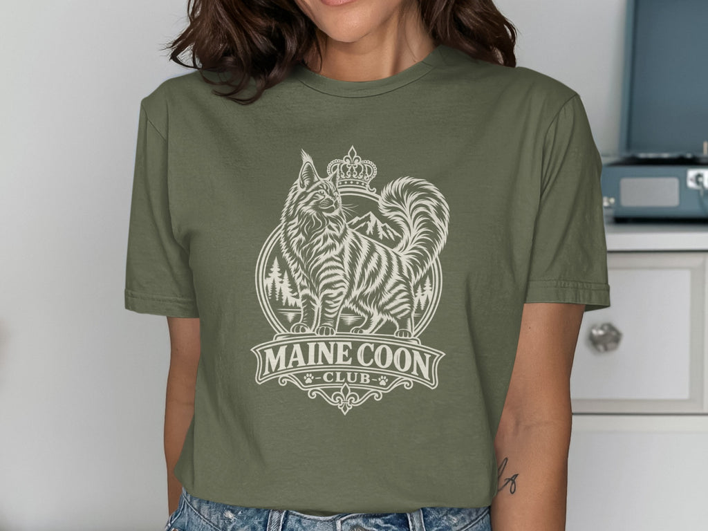 Olive green t-shirt with a white "Maine Coon Club" graphic of a cat wearing a crown.