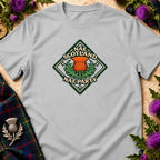 A light grey t-shirt featuring a diamond-shaped graphic with a thistle and the text Nae Scotland Nae Party.
