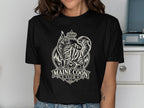 Black t-shirt with a cream graphic of a Maine Coon cat wearing a crown and "MAINE COON CLUB" text.