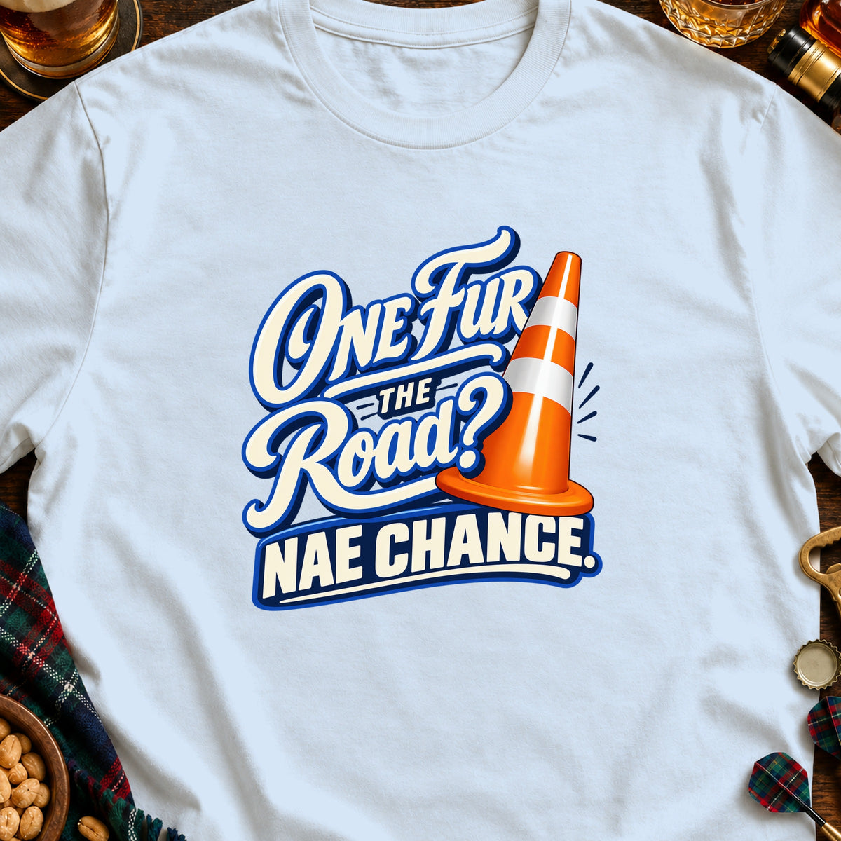 Light blue t-shirt with "One Fur the Road? Nae Chance." text and orange cone graphic.