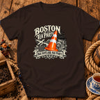 A dark brown short-sleeved t-shirt features a graphic with a traffic cone and text reading Boston Tea Party and Nae Scotland, Nae Party.